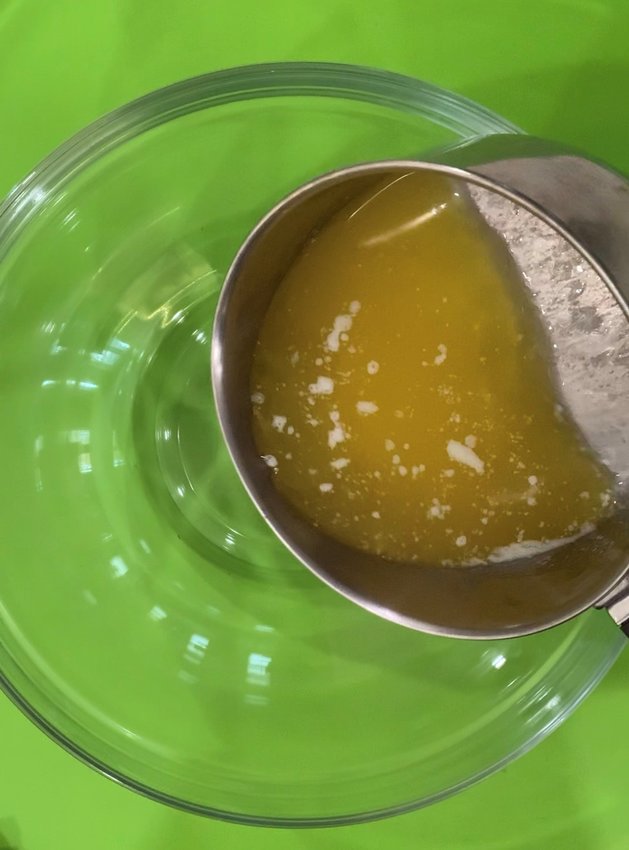 Melt the butter and pour into a mixing bowl.